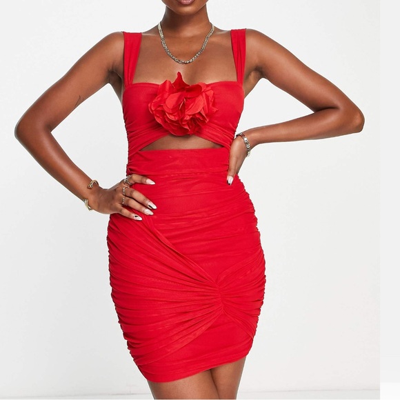 Dolls Kill Dresses & Skirts - Stunning red bustier corset dress with cut out and flower pin